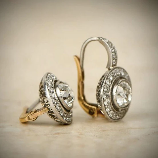 Crystal-embellished vintage earrings in gold and silver